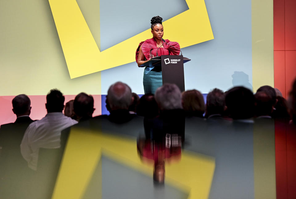 Writer Chimamanda Ngozi Adichie speaks during the ceremony marking the exhibition opening of the Ethnological Museum, the Museum of Asian Art of the National Museums in Berlin/Prussian Cultural Heritage Foundation and the Humboldt Forum Foundation in the Berlin Palace, Berlin, Germany, Wednesday Sept. 22, 2021. (Britta Pedersen/dpa via AP)