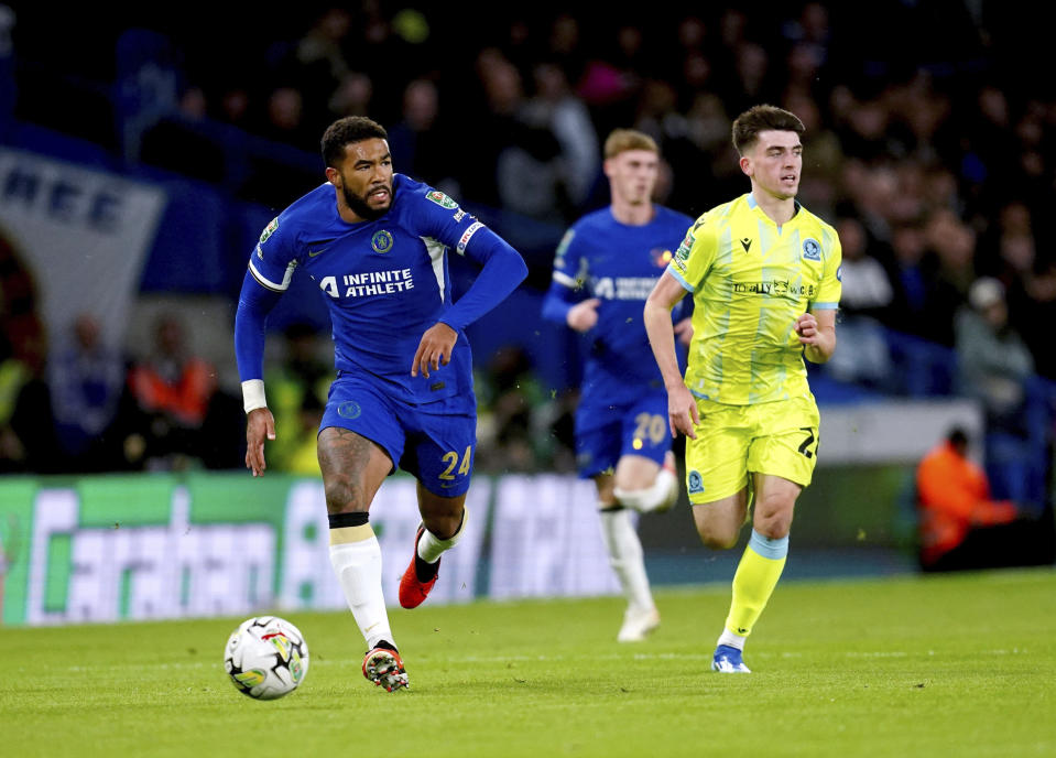 Chelsea's Reece James, left, and Blackburn Rovers' Andrew Moran battle for the ball during their English League cup fourth round soccer match at Stamford Bridge, London, Wednesday, Nov. 1, 2023. (Nick Potts/PA via AP)