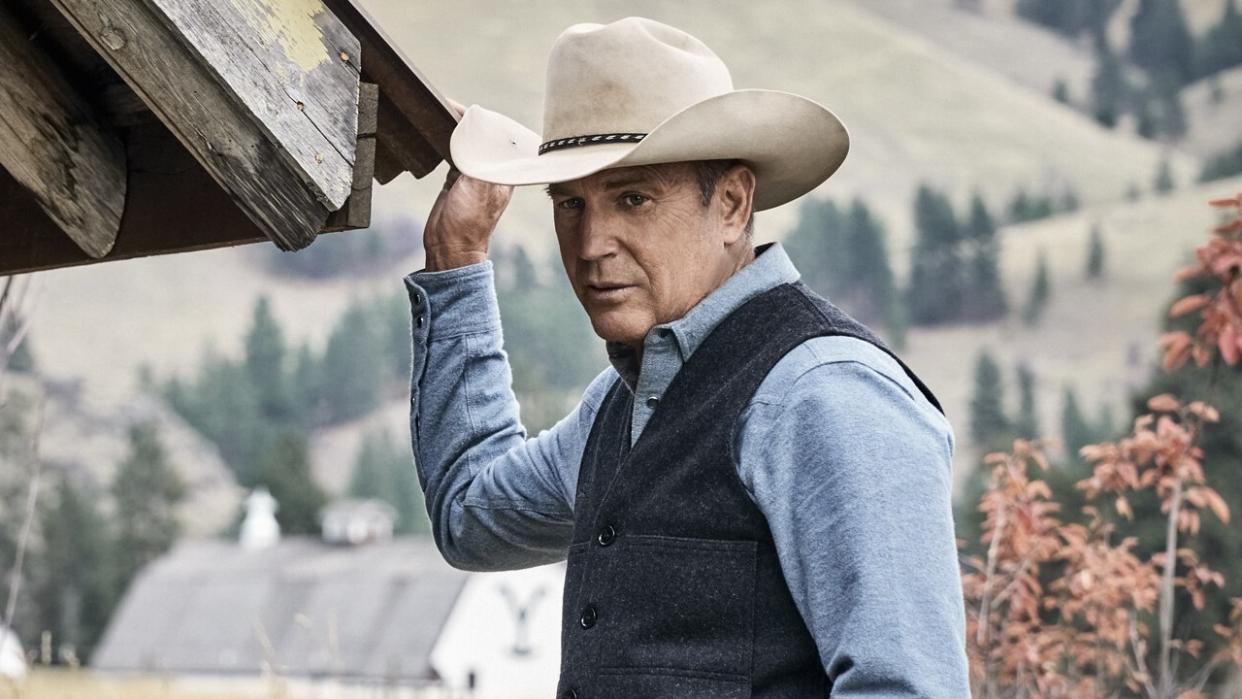  John Dutton outside ranch house in Yellowstone. 