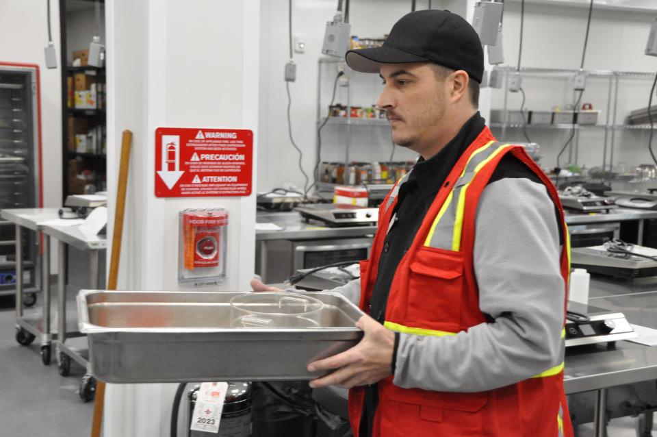 Bryan Anton works in the café at the new Food Bank of Delaware facility in Milford Jan. 12 after graduating from the Food Bank's culinary school in December.