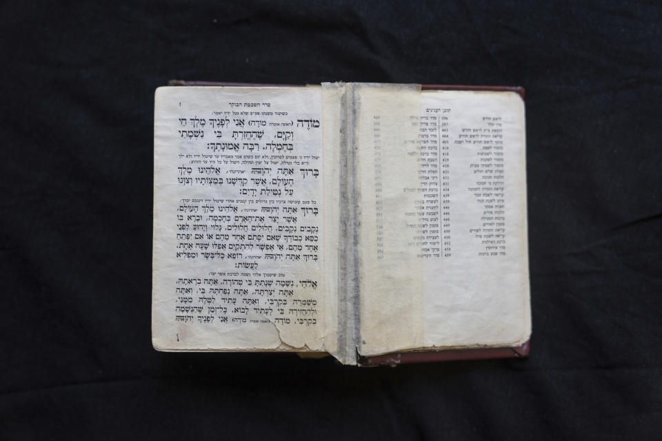 A Jewish prayer book used by Tamar Shabtai at her house in Mevaseret Zion, near Jerusalem, Wednesday, Aug. 30, 2023. Shabtai, 29, who grew up in a religious neighborhood in Jerusalem, is among the thousands of young people who leave Israel's ultra-Orthodox community each year. But she keeps the prayer book and says she hasn't abandoned her faith altogether. (AP. Photo/Ohad Zwigenberg)