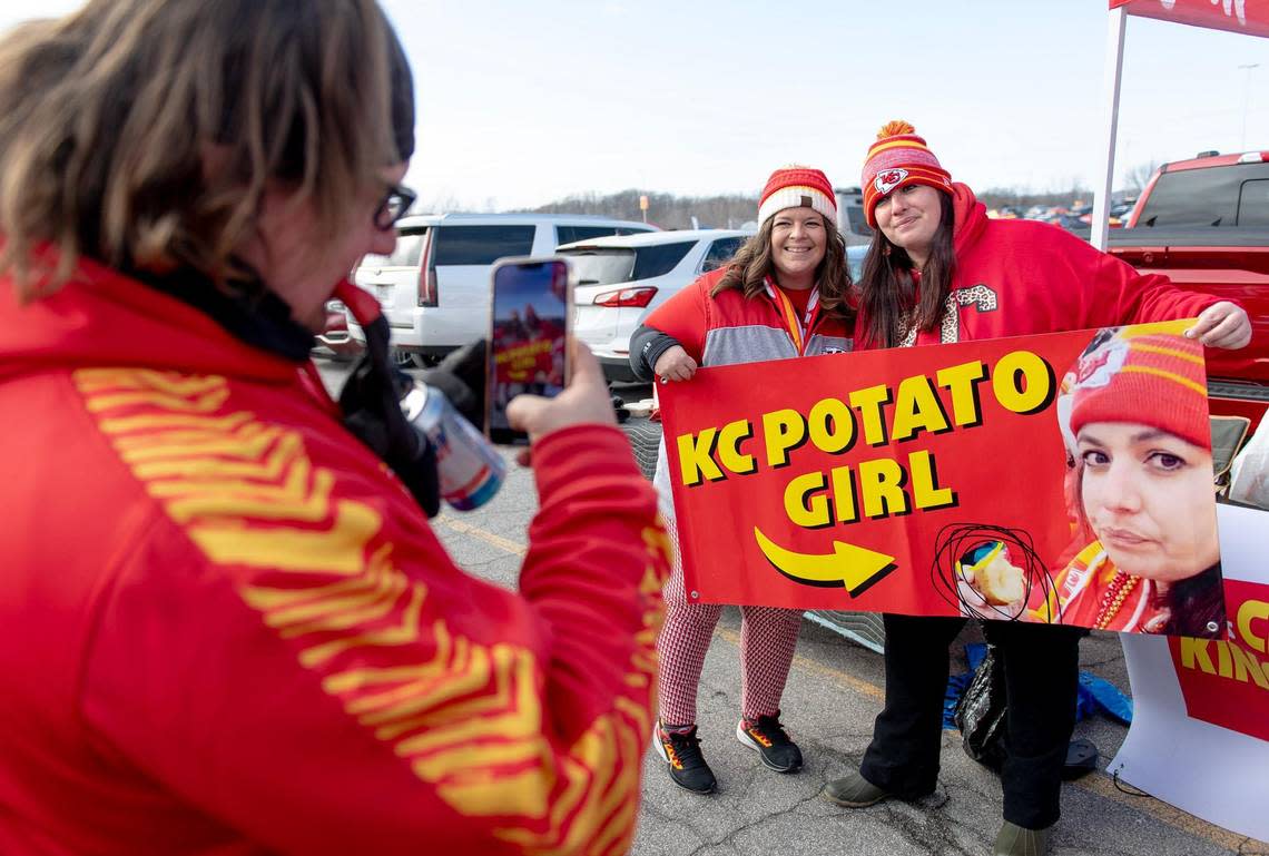 Calli Stuart poses for a photo with Nicki Conrad, right, aka “KC Chiefs Potato Girl,” at a tailgating event outside Arrowhead Stadium before the Kansas City Chiefs and Cincinnati Bengals AFC Championship football game on Sunday, Jan. 29, 2023, in Kansas City.