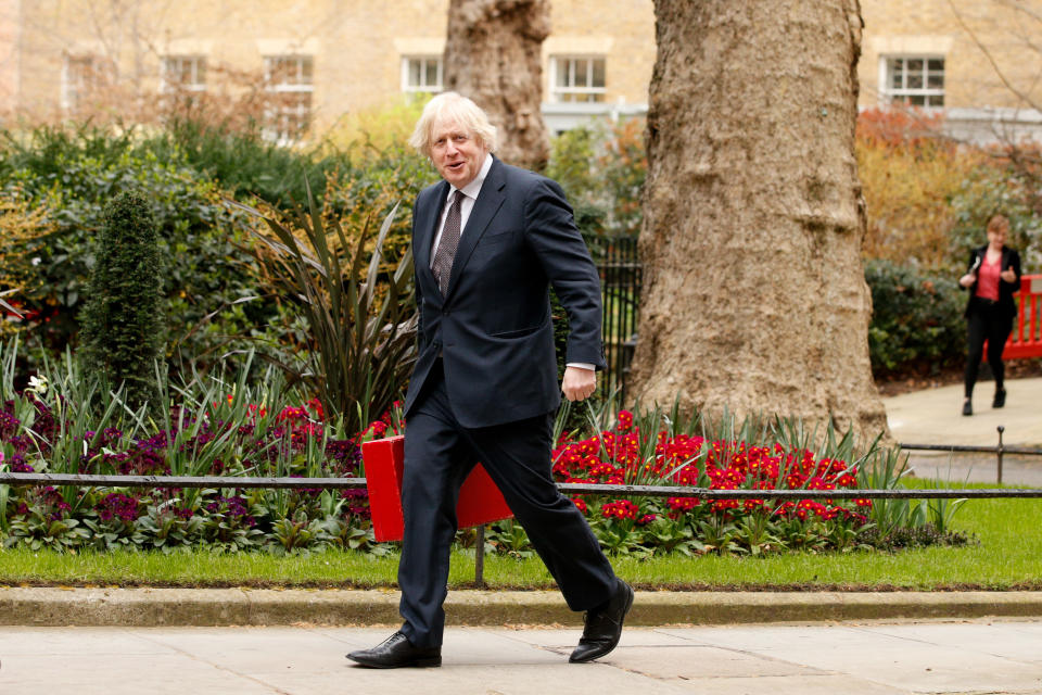 LONDON, UNITED KINGDOM - MARCH 25: British Prime Minister Boris Johnson walks up Downing Street in London, United Kingdom on March 25, 2021. Members of Parliament debate and vote later today on a six-month renewal of the wide-ranging government powers contained in the Coronavirus Act. (Photo by David Cliff/Anadolu Agency via Getty Images)