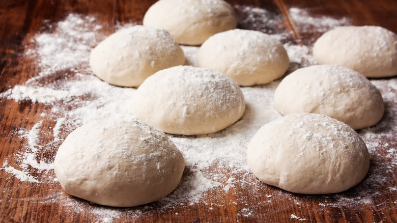 floured balls of pizza dough