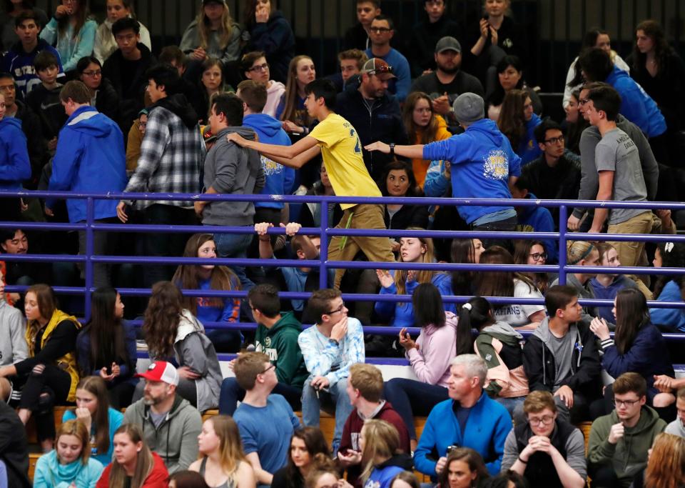 Students leave during a community vigil held to honor the victims and survivors of yesterday's fatal shooting at the STEM School Highlands Ranch, late Wednesday, May 8, 2019, in Highlands Ranch, Colo.