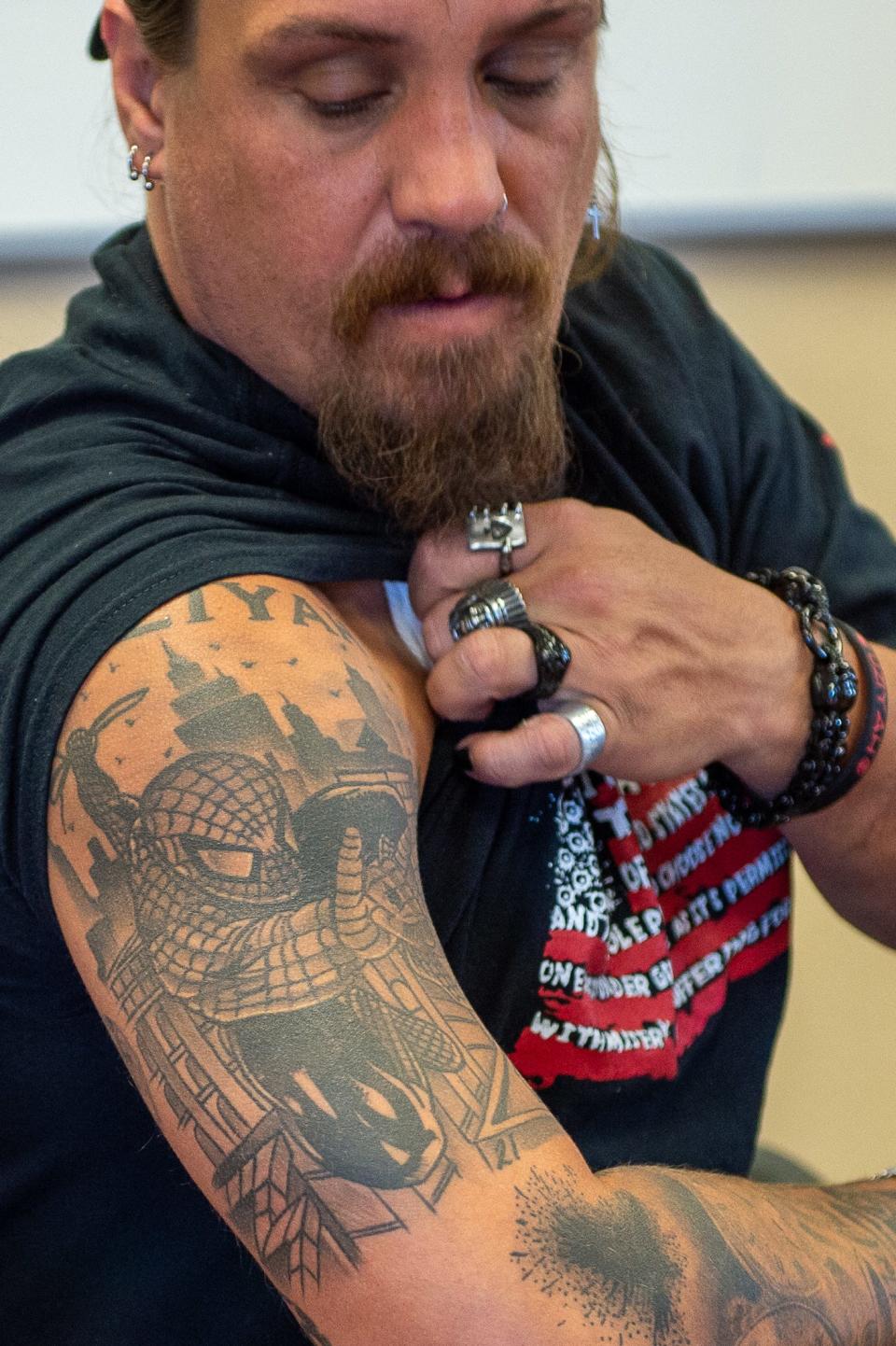 Brett Cross has a Spider-Man tattoo because the character was slain son Uzi’s favorite superhero.