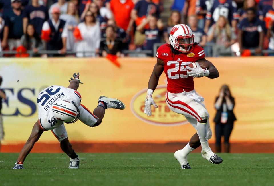 Melvin Gordon rushed for 251 yards and three touchdowns on 34 carries in an overtime victory over Auburn in the Outback Bowl that followed the 2014 season.