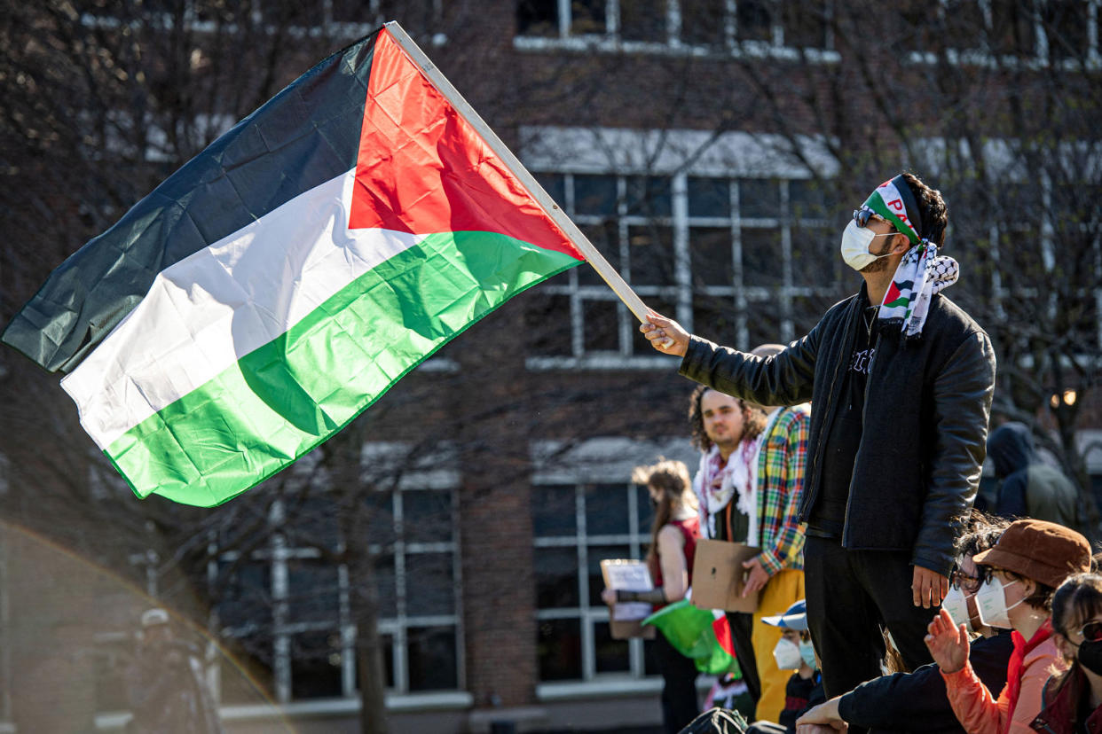 A person waves a Palestinian flag. (Joseph Prezioso / AFP - Getty Images file)