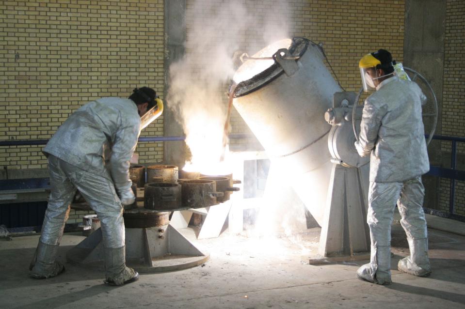 Technicians work inside a uranium conversion facility in Iran.