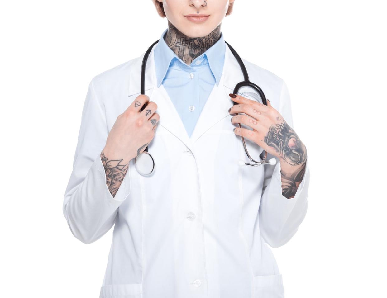 <span class="caption">In the not-too-distant future, tattoos could become medical diagnostic devices as well as body art.</span> <span class="attribution"><a class="link " href="https://www.gettyimages.com/detail/photo/cropped-view-of-female-doctor-in-white-coat-with-royalty-free-image/918494936?adppopup=true" rel="nofollow noopener" target="_blank" data-ylk="slk:LightFieldStudios/iStock via Getty Images;elm:context_link;itc:0;sec:content-canvas">LightFieldStudios/iStock via Getty Images </a></span>