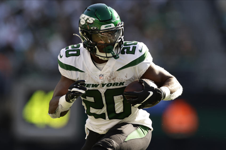 New York Jets running back Breece Hall (20) carries the ball against the Miami Dolphins during the fourth quarter of an NFL football game, Sunday, Oct. 9, 2022, in East Rutherford, N.J. (AP Photo/Adam Hunger)