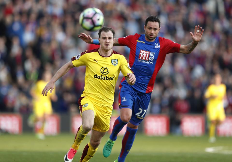 <p>Burnley’s Ashley Barnes in action with Crystal Palace’s Damien Delaney </p>