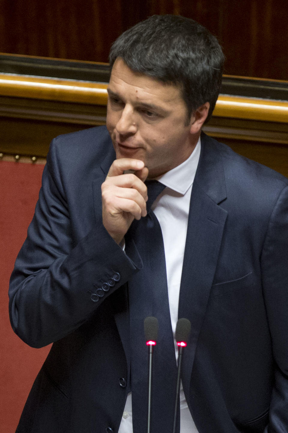 Premier Matteo Renzi delivers his speech prior to a confidence vote, at the Senate, in Rome, Monday, Feb. 24, 2014. Renzi is pitching for support in Parliament ahead of mandatory confidence votes on his brand-new coalition. Democratic Party leader Renzi told the Senate Monday he needs support for a "bold vision" that will get economically stagnate Italy dreaming again. Without giving details, Renzi said debt-laden Italy must heal its public finances not because Germany's leader, Angela Merkel or the European Central Bank chief want us "to get serous" but because "it's our children" who seek a future. (AP Photo/Andrew Medichini)