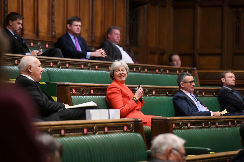Britain's former Prime Minister Theresa May reacts during a debate at the House of Commons in London