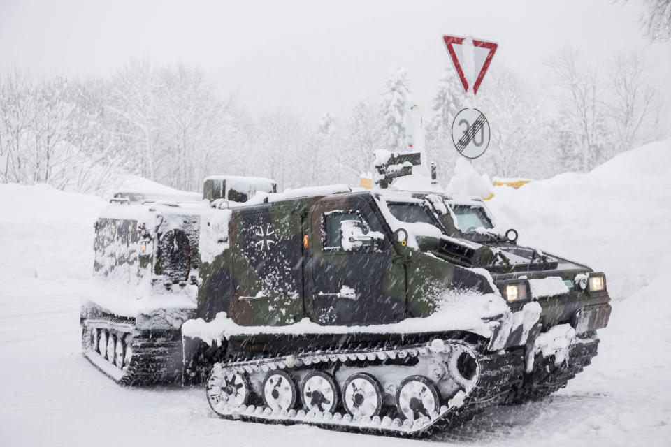 A track vehicle of the German army provides food to a village near Berchtesgaden, southern Germany, Thursday, Jan. 10, 2019 after southern Germany and Austria have been hit by heavy snowfall. (Bernd Maerz/dpa via AP)