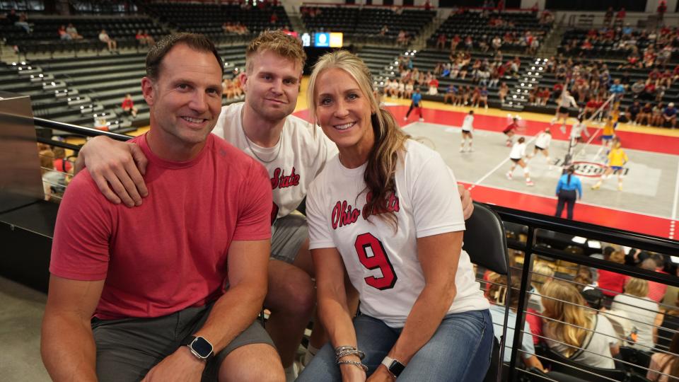 Aug 19, 2023; Columbus, Ohio, United States; Inside the Covelli Center, Jerame and Molly Tuman attend an Ohio State volleyball game to watch their daughter, Mia Tuman, a freshman setter for team. Her brother, Canyon, is between his parents. Mia's father, Jerame Tuman, played for Michigan football, and Mia grew up a huge Michigan fan. Her mother, Molly Tuman,  was a Division 1 volleyball player at Kentucky.