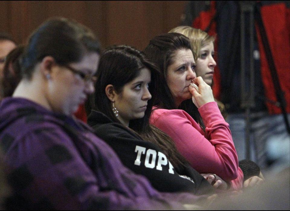 Community members attend a during a prayer service for victims of a school shooting at Chardon Assembly of God in Chardon, Ohio on Feb. 27, 2012. A gunman opened fire inside the Chardon High School's cafeteria at the start of the school day Monday, killing three students and wounding two others.  