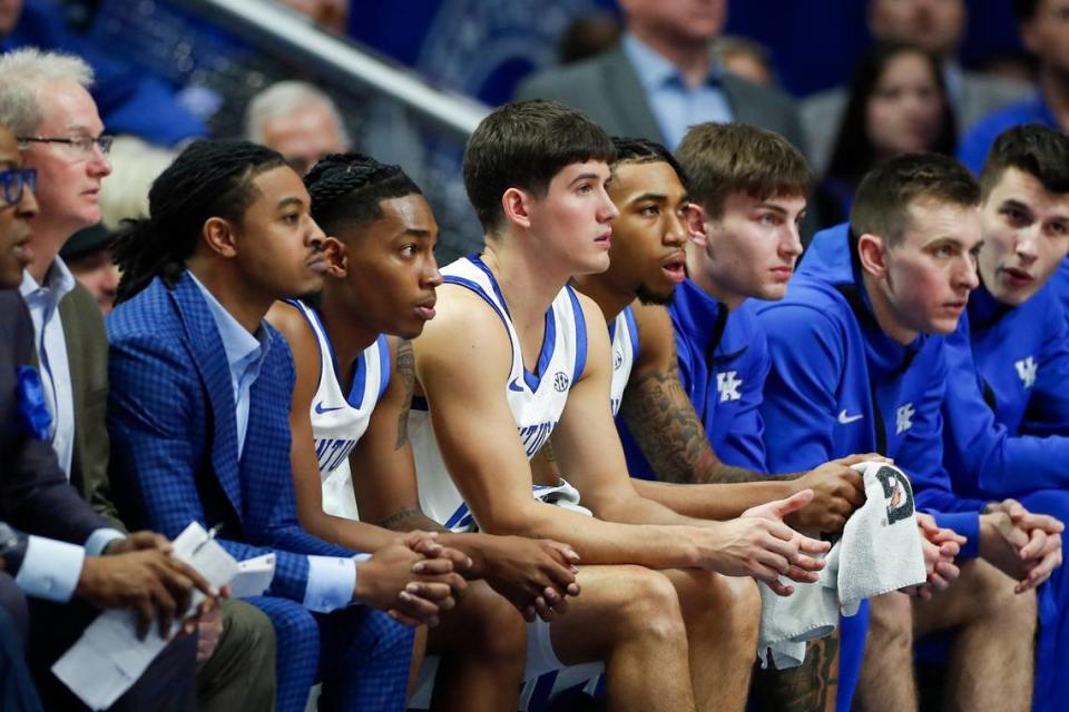 Kentucky guards Reed Sheppard and Rob Dillingham sit together on the bench during the Wildcats’ 95-73 victory over Miami on Tuesday night.