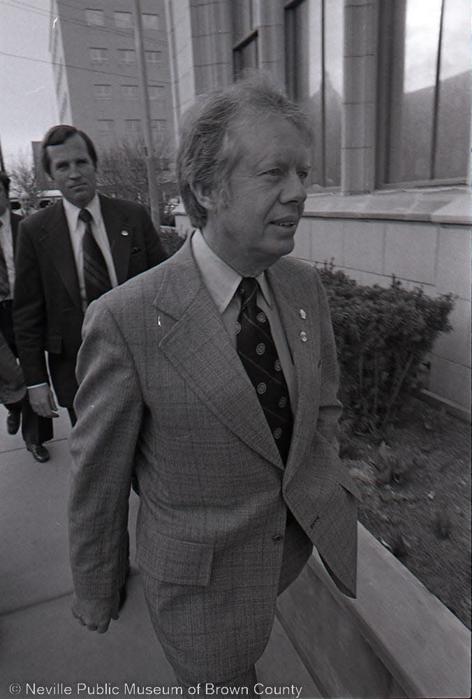 Jimmy Carter, then the former Georgia governor, walks down Walnut Street in front of the Green Bay Press-Gazette on March 26, 1976, during the primary campaign against U.S. Rep. Morris King Udall.