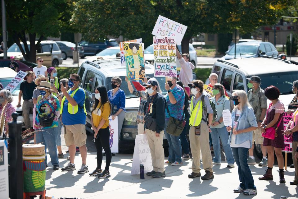 Demonstrators gather at the Pueblo County Courthouse for the Women's March for Southern Colorado on October 2, 2021. The rally was in response to restrictive abortion laws passed in Texas.