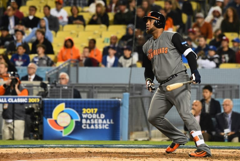 Wladimir Balentien of the Netherlands hits a double in the fifth inning against Puerto Rico during the World Baseball Classic, at Dodger Stadium in Los Angeles, on March 20, 2017