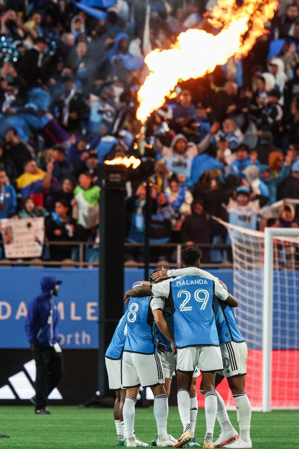 Charlotte FC players gather in a huddle after a defeating New York City FC, 1-0, during the home opener at Bank of America Stadium in Charlotte, NC on February 24, 2024.