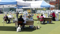 People take a test for the new coronavirus at a testing facility in Incheon, South Korea, Wednesday, May 13, 2020. (Yun Tae-hyun/Yonhap via AP)