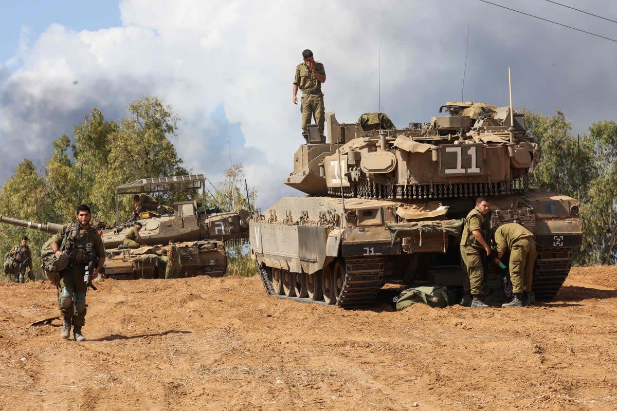 Israeli army personnel prepare for battle near Ashkelon on Sunday (AFP)