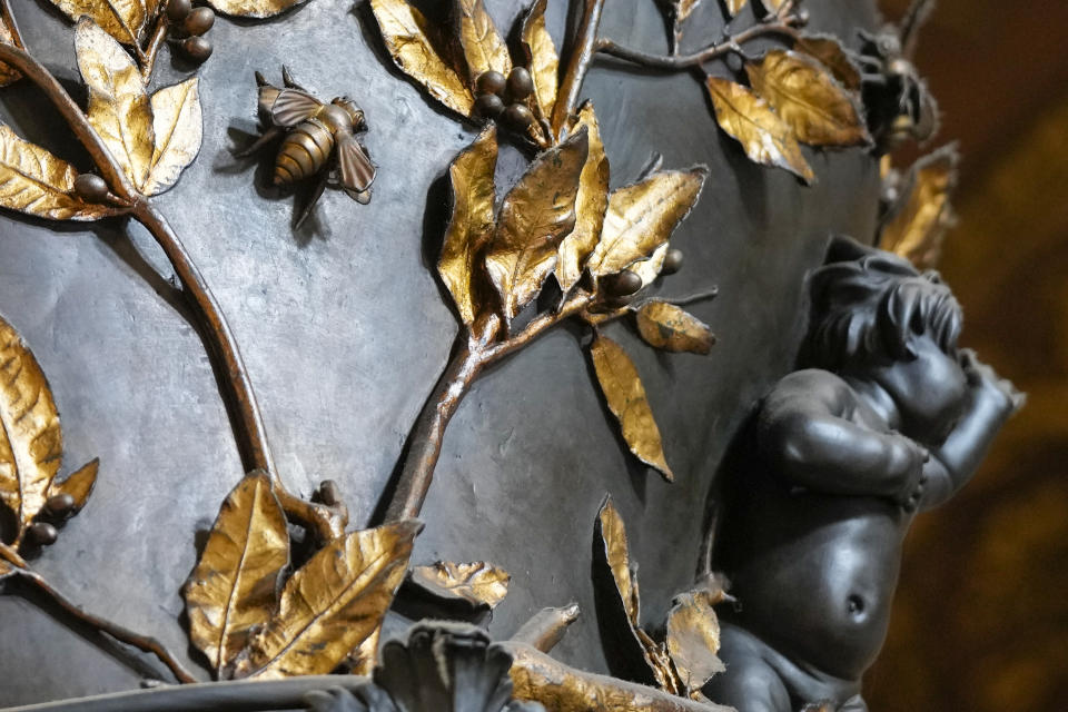 A detail of the leaves that adorn the columns of the 17th century, 95ft-tall bronze canopy by Giovan Lorenzo Bernini surmounting the papal Altar of the Confession in St. Peter's Basilica at the Vatican, Wednesday, Jan. 10, 2024. Vatican officials unveiled plans Thursday, Jan.11, for a year-long, 700,000 euro restoration of the monumental baldacchino, or canopy, of St. Peter's Basilica, pledging to complete the first comprehensive work on Bernini's masterpiece in 250 years before Pope Francis' big 2025 Jubilee. (AP Photo/Andrew Medichini)