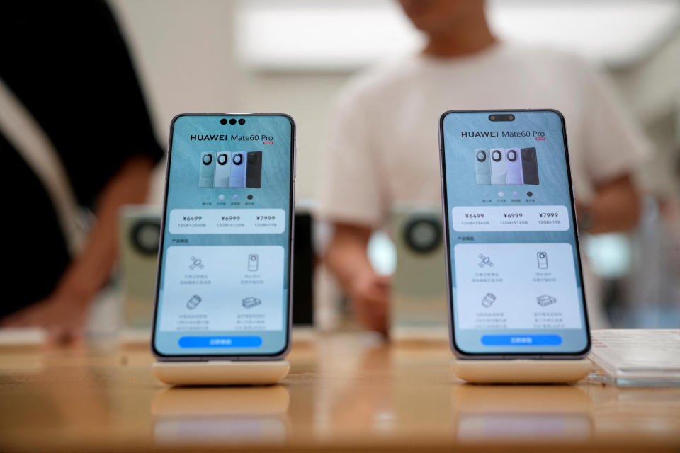 Pricing details of Huawei's Mate 60 Pro smartphones are seen on smartphones displayed at a Huawei store in Shanghai, China September 8, 2023. REUTERS/Aly Song