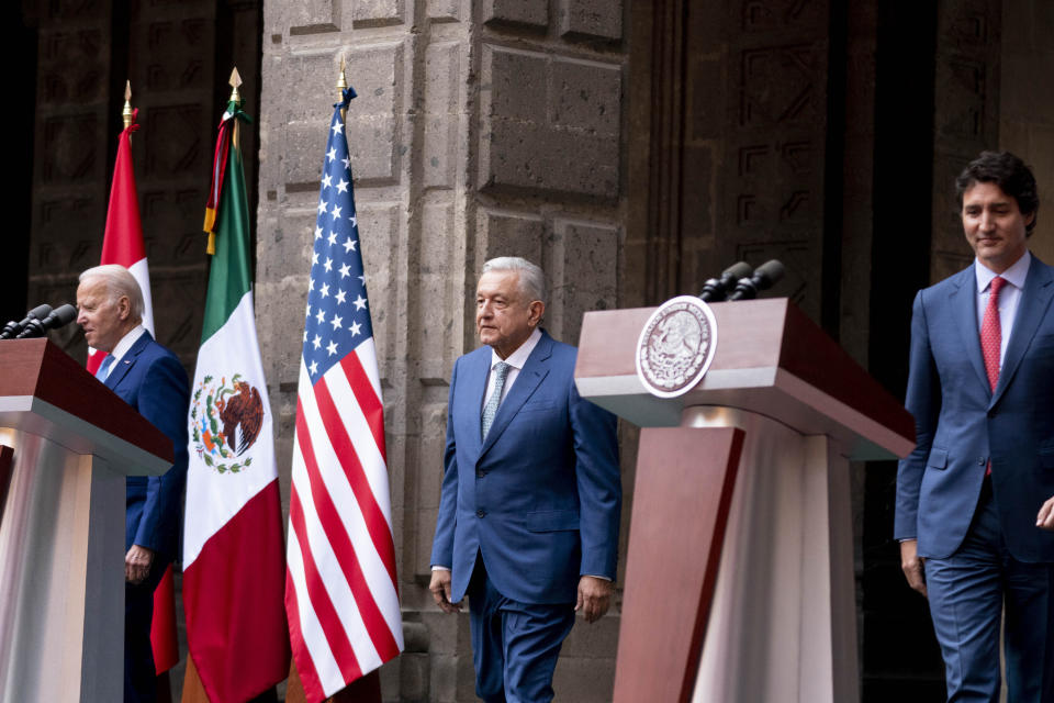 President Joe Biden, Mexican President Andres Manuel Lopez Obrador, and Canadian Prime Minister Justin Trudeau arrive for a news conference at the 10th North American Leaders' Summit at the National Palace in Mexico City, Tuesday, Jan. 10, 2023. (AP Photo/Andrew Harnik)