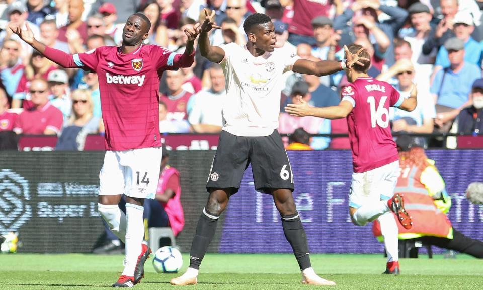 Paul Pogba argues with the referee Michael Oliver (out of picture) as Pedro Obiang (left) remonstrates during Manchester United’s defeat at West Ham.