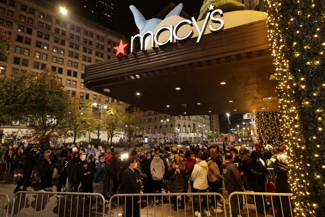 People wait in line at Macy's before Black Friday sales in the Manhattan borough of New York City, New York, U.S., November 26, 2021. REUTERS/Jeenah Moon - REFILE - CORRECTING DATE