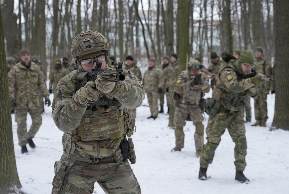 Members of Ukraine's Territorial Defense Forces, volunteer military units of the Armed Forces, train in a city park in Kyiv, Ukraine, Saturday, Jan. 22, 2022. Dozens of civilians have been joining Ukraine's army reserves in recent weeks amid fears about Russian invasion. (AP Photo/Efrem Lukatsky)