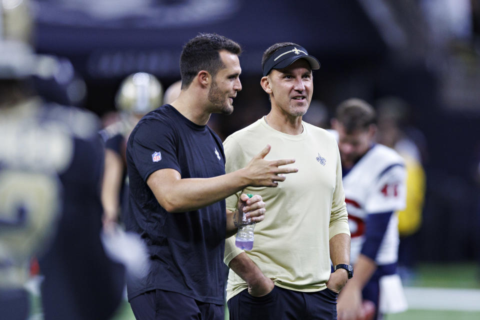 NEW ORLEANS, LOUISIANA – AUGUST 27: Head Coach Dennis Allen of the New Orleans Saints (R) talks with <a class="link " href="https://sports.yahoo.com/nfl/players/27564" data-i13n="sec:content-canvas;subsec:anchor_text;elm:context_link" data-ylk="slk:Derek Carr;sec:content-canvas;subsec:anchor_text;elm:context_link;itc:0">Derek Carr</a> #4 of the New Orleans Saints before the preseason game against the Houston Texans at Caesars Superdome on August 27, 2023 in New Orleans, Louisiana. (Photo by Wesley Hitt/Getty Images)