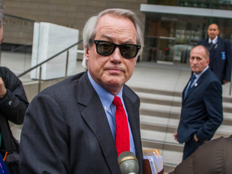 <p>Attorneys L. Lin Wood (C) and Mark Stephen (L) speak to the media about their client, British rescue diver Vernon Unsworth (rear), as they arrive at US District Court on 3 December 2019 in Los Angeles, California</p> ((Getty Images))