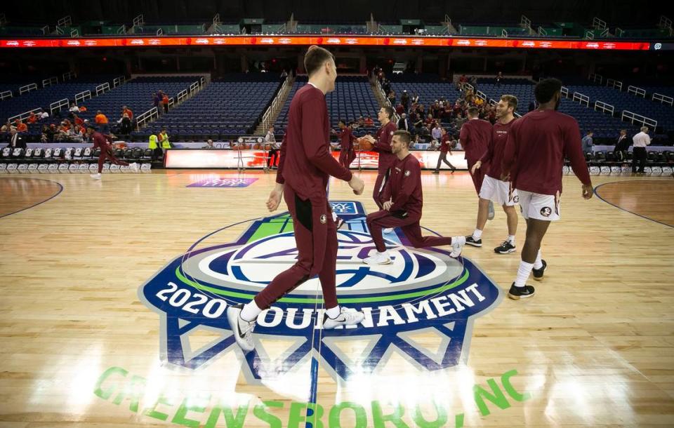 The Florida State Seminoles take to the court in an empty Greensboro Coliseum as they warm up for their game against Clemson on Thursday, March 12, 2020 in Greensboro, N.C. Fans have been prohibited from attending due to COVID-19 virus. Moments later the game was cancelled as was the remainder of the tournament.