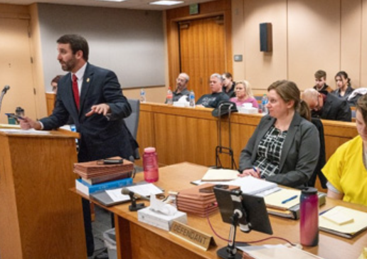 Left to Right: Anchorage Assistant District Attorney Patrick McKay Jr., defense Attorney Emily Cooper, and 23-year-old Denali Brehmer (in yellow), who pleaded guilty to first-degree murder in the death of her 19-year-old friend.