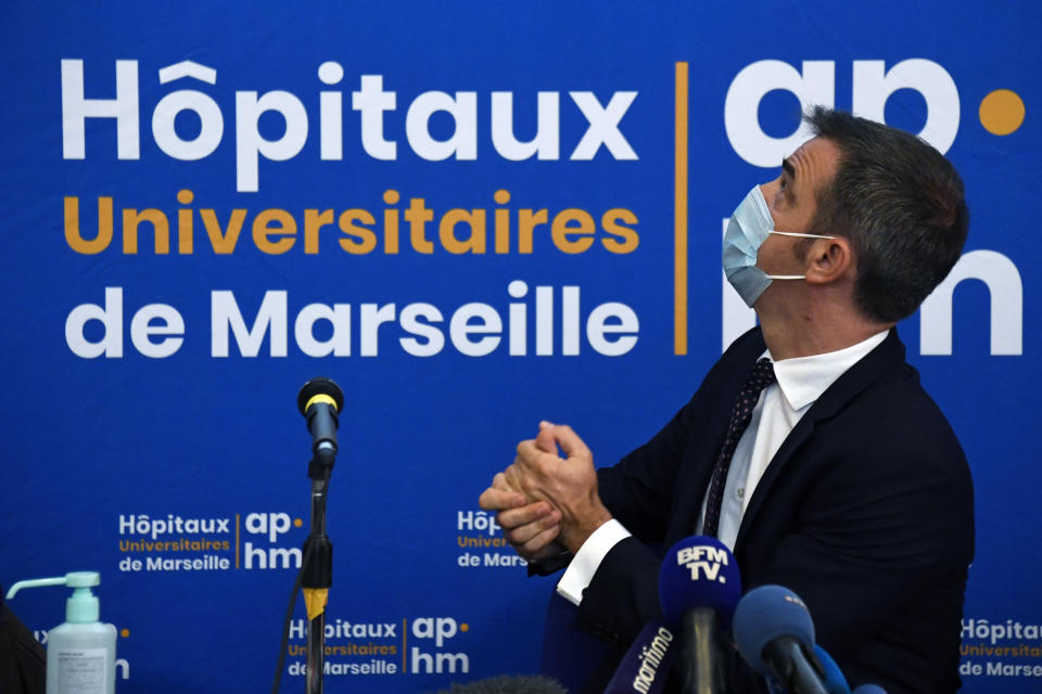 French Health Minister Olivier Veran holds a press conference at La Timone public hospital, Friday Sept. 25, 2020 in Marseille, southern France. Angry restaurant and bar owners demonstrated in Marseille to challenge a French government order to close all public venues as of Saturday to battle resurgent virus infections. The government argues that hospitals in this Mediterranean city are under strain and the closures are the only way to stem the spread while avoiding new lockdowns. (Christophe Simon, Pool via AP)