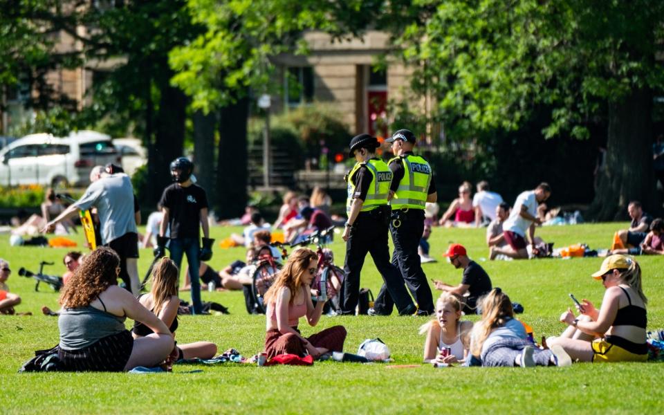 Police arrive at The Meadows in Edinburgh on Friday, as lockdown restrictions meant people could gather in parks for the first time in weeks - Stuart Nicol/Stuart Nicol Photography