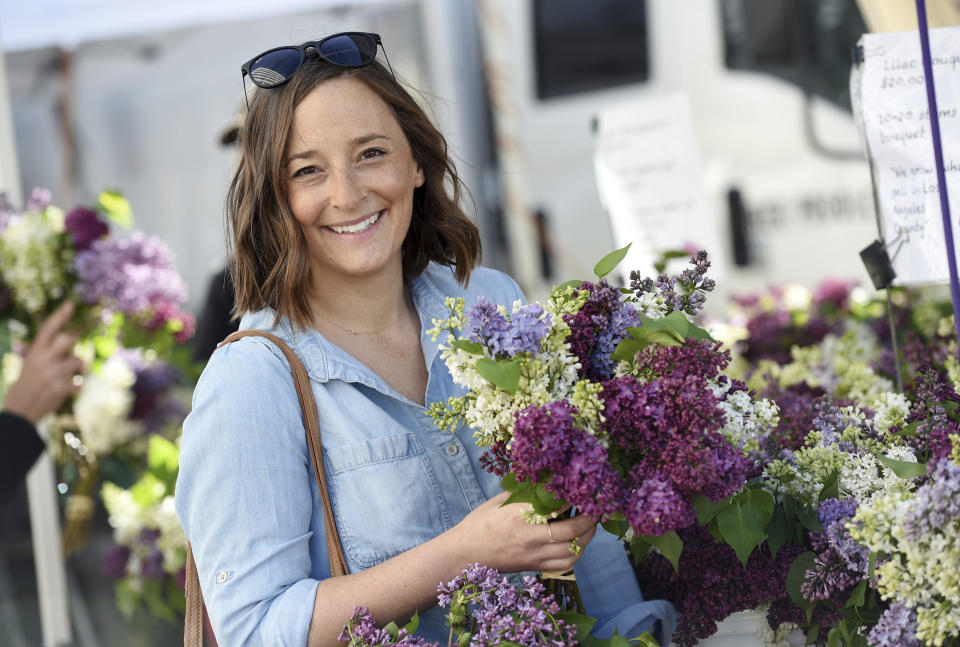 This April 10, 2019 photo shows Gaby Dalkin at Santa Monica Downtown Farmers Market in Santa Monica, Calif. Dalkin, the chef behind the popular Website and social media accounts, What’s Gaby Cooking, is forging her own path. Every Monday she posts a live demo to Instagram as she cooks dinner which has become appointment viewing for some fans. Her husband films it and reads questions from viewers as she’s cooking. (AP Photo/Chris Pizzello)