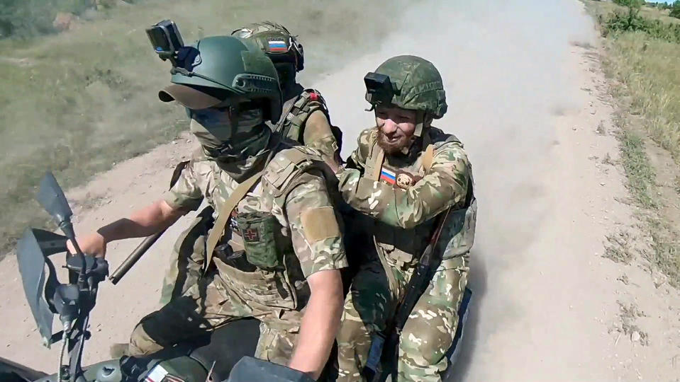 In this photo, taken from video released by the Russian Defense Ministry Press Service on Monday, July 1, 2024, Russian soldiers ride a quad bike changing their positions at the frontline in an undisclosed location in Ukraine. (Russian Defense Ministry Press Service via AP, File)