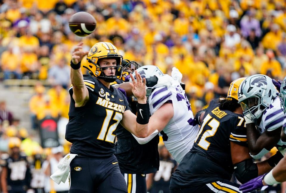 Sep 16, 2023; Columbia, Missouri, USA; Missouri Tigers quarterback Brady Cook (12) throws a pass against the Kansas State Wildcats during the first half at Faurot Field at Memorial Stadium. Mandatory Credit: Jay Biggerstaff-USA TODAY Sports