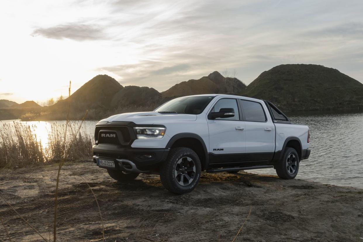 Dodge Ram next to lake at sunset