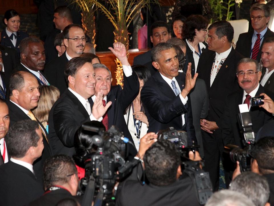 Panama's President Juan Carlos Varela, Cuba's President Raul Castro and U.S. President Barack Obama wave before the inauguration of the VII Summit of the Americas in Panama City