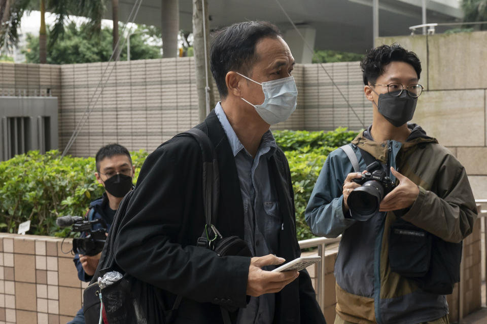 Hong Kong scholar Hui Po-keung arrives at the West Kowloon Magistrates's Courts in Hong Kong, Friday Nov. 25, 2022. Hong Kong Cardinal Joseph Zen and five others were in court on Friday over charges of failing to register a now-defunct fund that aimed at helping people arrested in the widespread protests three years ago. (AP Photo/Anthony Kwan)