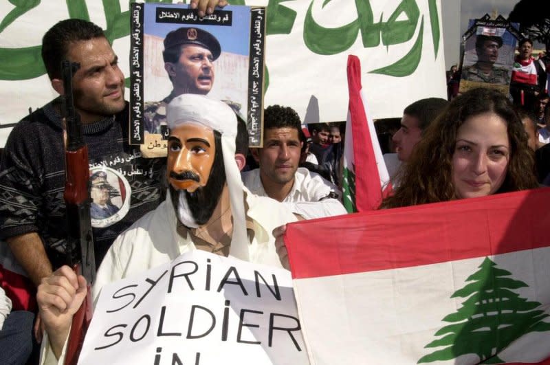 Lebanese students demonstrate in Beirut on March 14, 2002, against Syria`s military presence in their country. On April 26, 2005, the last of Syria's troops left Lebanon, ending a 29-year military presence. File Photo by Mahmoud Tawil/UPI