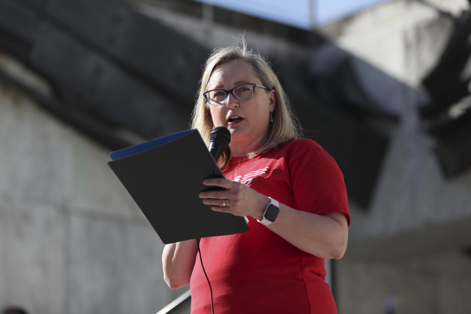 Hilary Uhlig, Oregon chapter leader for Moms Demand Action for Gun Sense America, speaks during a rally calling for an end to the Senate Republican walkout at the Oregon State Capitol in Salem, Ore., Thursday, May 11, 2023. (AP Photo/Amanda Loman)