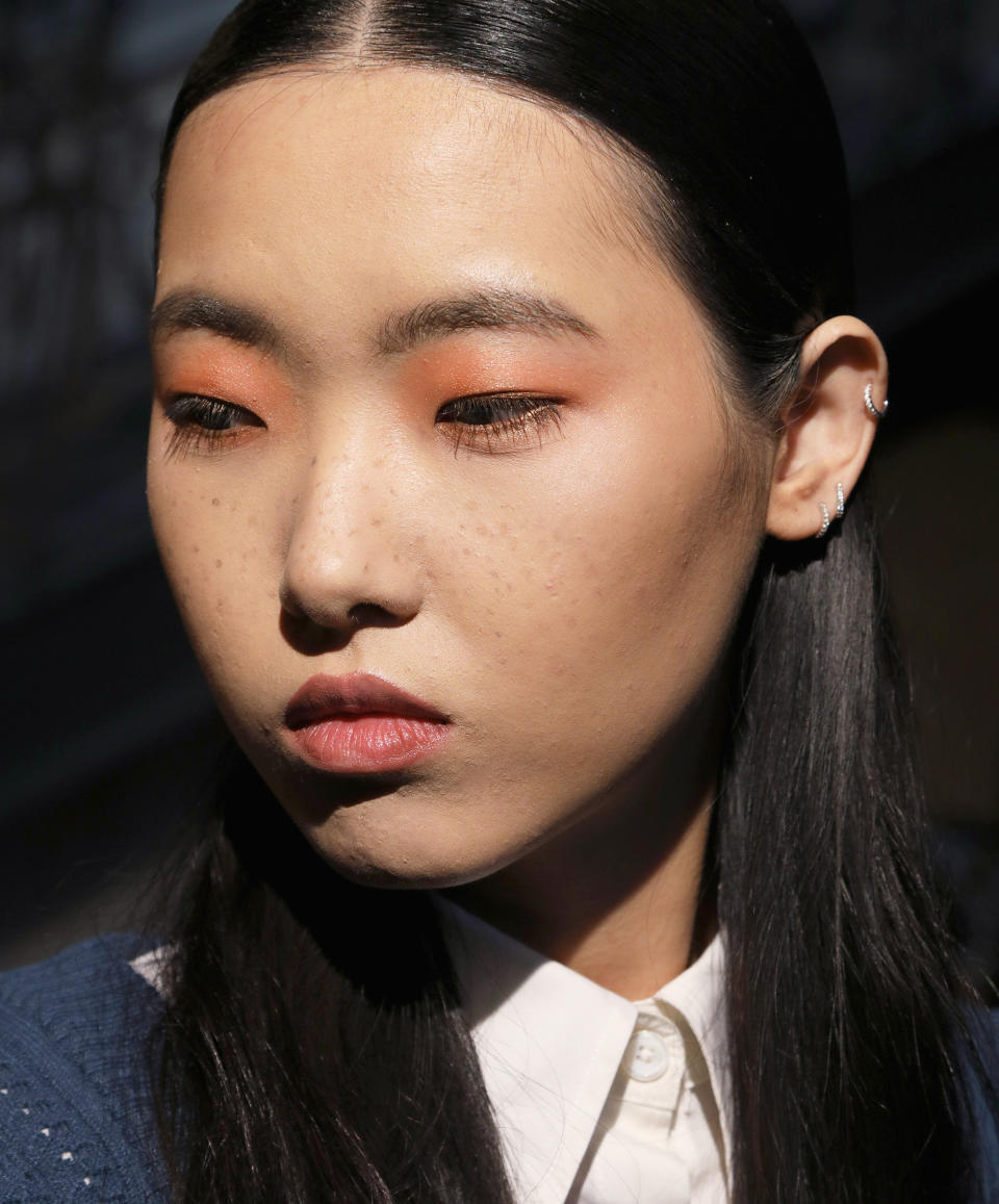 <p>Lead hairstylist Bok-Hee for Cantu kept each girl's strands sleek and center-parted on top, with loose texture on the ends. For the makeup, Mary Kay artist Luis Casco stuck to bronze and sienna tones on the eyes, and added faux freckles that spanned from cheek to cheek.</p>