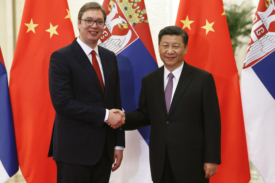FILE- Serbian Prime Minister Aleksandar Vucic, left, and Chinese President Xi Jinping pose for photographers as they meet at the Great Hall of the People in Beijing Tuesday, May 16, 2017. The two countries have a long history of friendship, particularly since 1999, when NATO bombed the Chinese embassy in Belgrade, killing three Chinese nationals, during the air war to end Serbia's brutal crackdown on ethnic Albanian separatists in Kosovo. (Damir Sagolj/Pool Photo via AP)